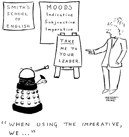 Language school 
teacher, with list of verbal moods behind him, is illustrating the 
imperative on a blackboard with the sentence: TAKE ME TO YOUR LEADER. The 
student is a Dalek.
