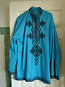 Jocelyn's turquoise shirt 
with black embroidery